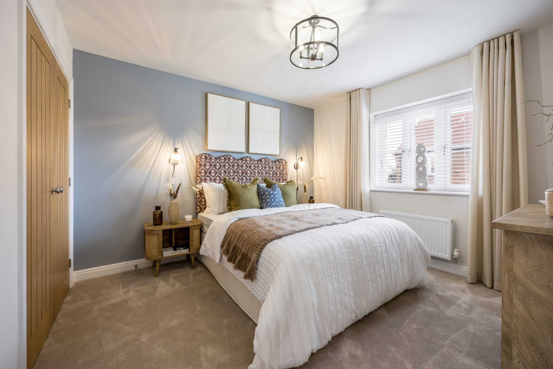 View from a bedroom inside the Morden home by Wyatt Homes with double bed.