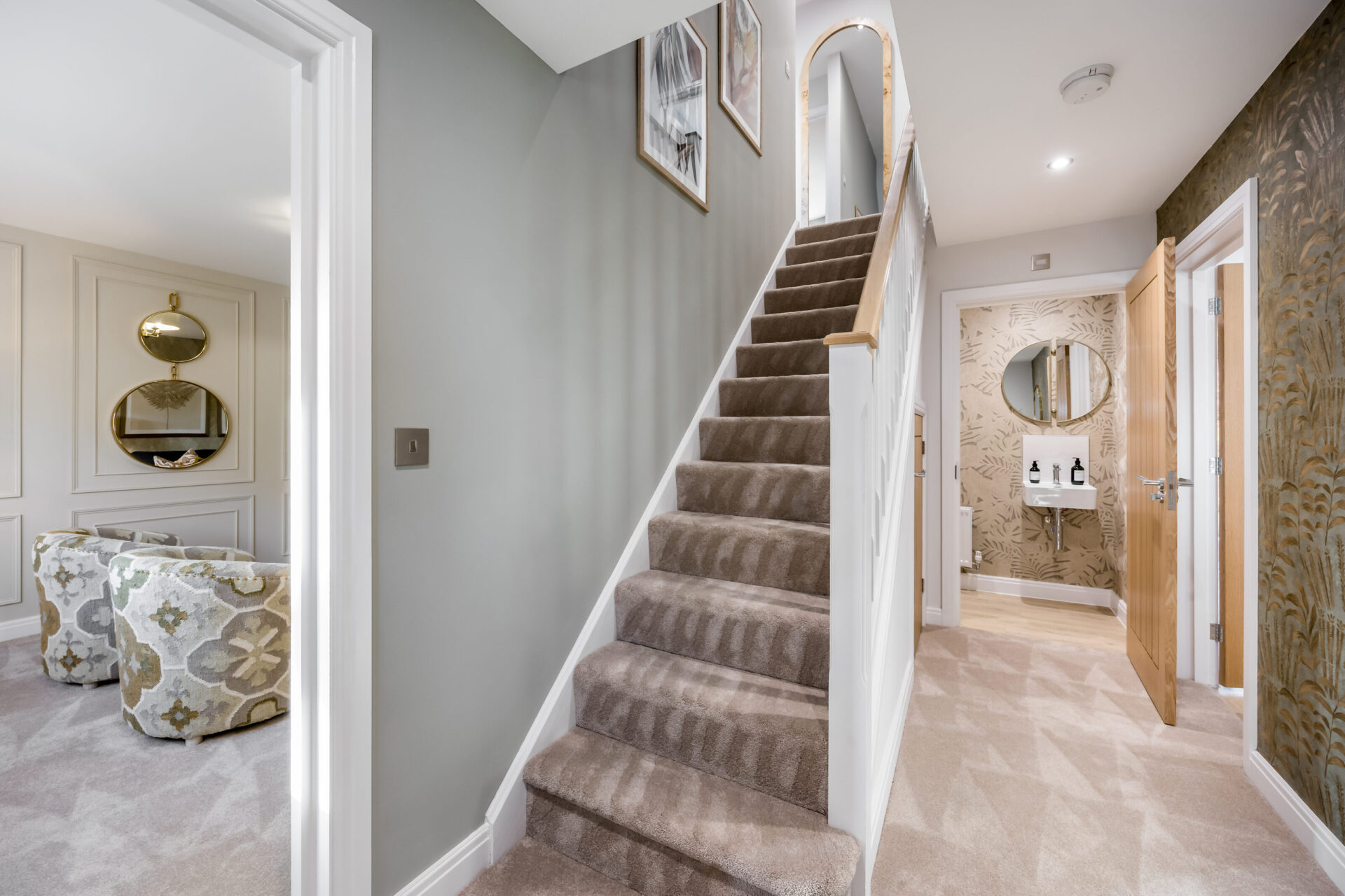 View of the staircase and entrance hallway inside the Morden home by Wyatt Homes.
