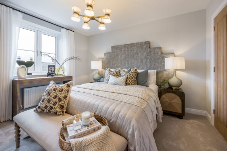 A view of a bedroom inside the Lytchett 4 bedroom home